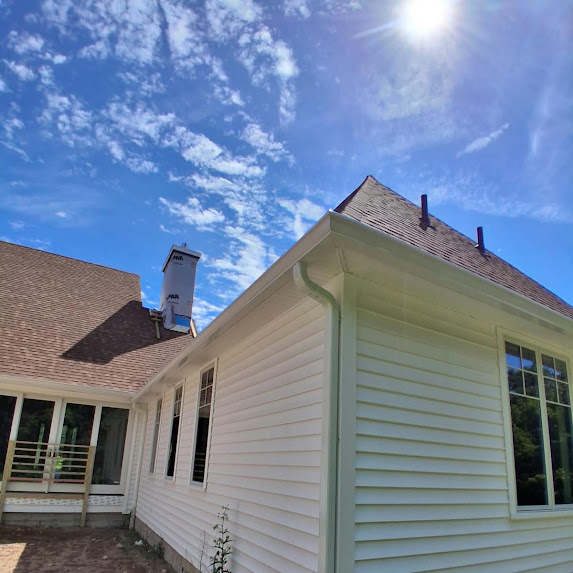 White 6-inch K-style seamless gutter and 3x4 downspout installed by Invictos Services in Glastonbury Connecticut